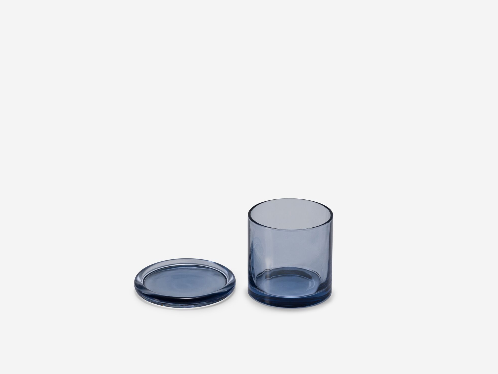 Medium glass organization container with lid beside front view